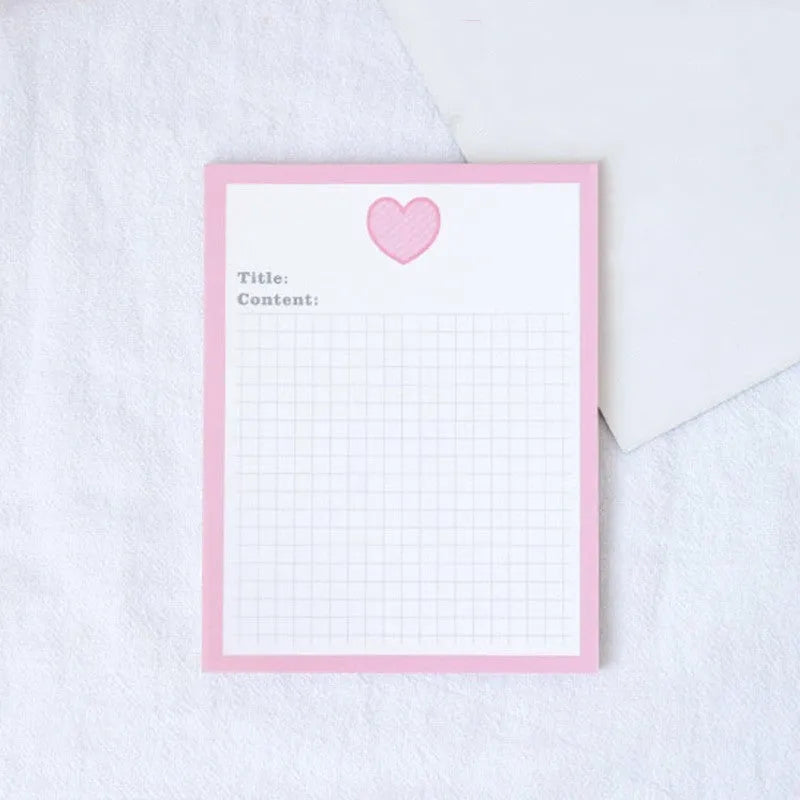 Cartoon sticky note pad in avocado or bear design, showing large and small size options next to a pen.