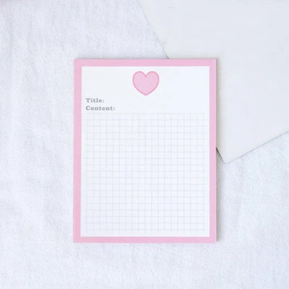 Cartoon sticky note pad in avocado or bear design, showing large and small size options next to a pen.