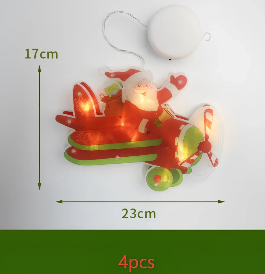 LED Christmas hanging lights with suction cups showing snowman design illuminated on window