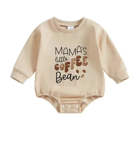 Apricot coloured infant jumpsuit with embroidered alphabet detailing and long sleeves