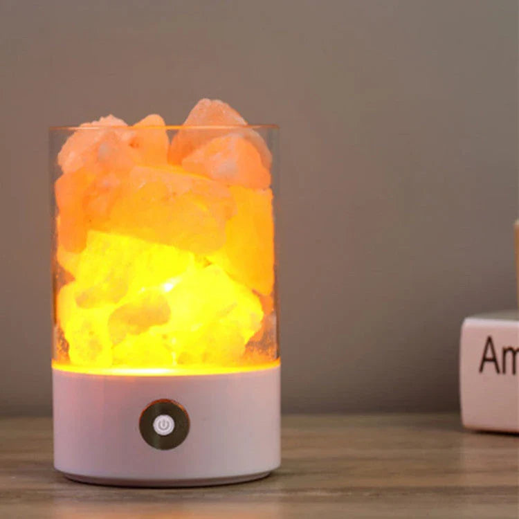 Himalayan salt lamp with warm, soothing glow and color-changing capabilities for air purification and relaxation