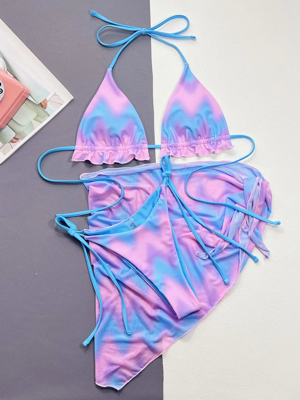 Women's split tie-dye bikini set with skirt, bra, and panties in pictured colour