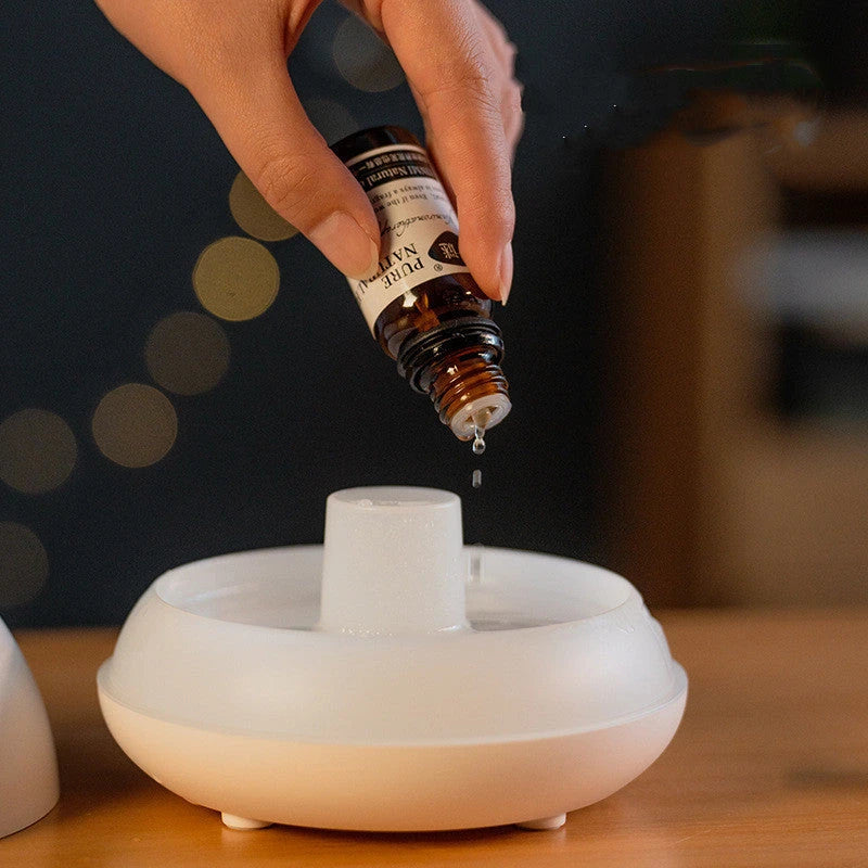 Aromatherapy diffuser with realistic flame-like lighting, color-changing mood lights, and essential oil diffusion capabilities