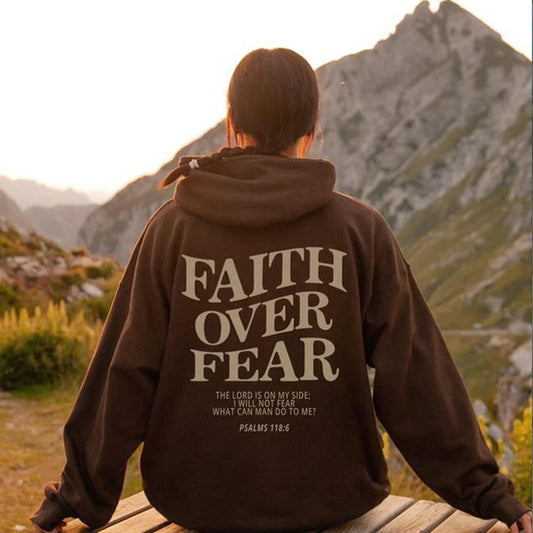 A stylish Christian hoodie with inspirational graphics and a message of faith over fear