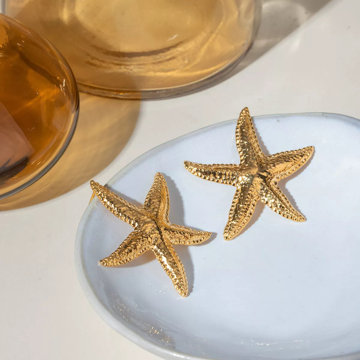 Serene Gold Starfish Earrings in stainless steel with gold electroplated finish