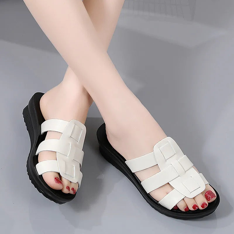 Women's large size flat bottom slippers in beige, black and brown colours with PU leather construction