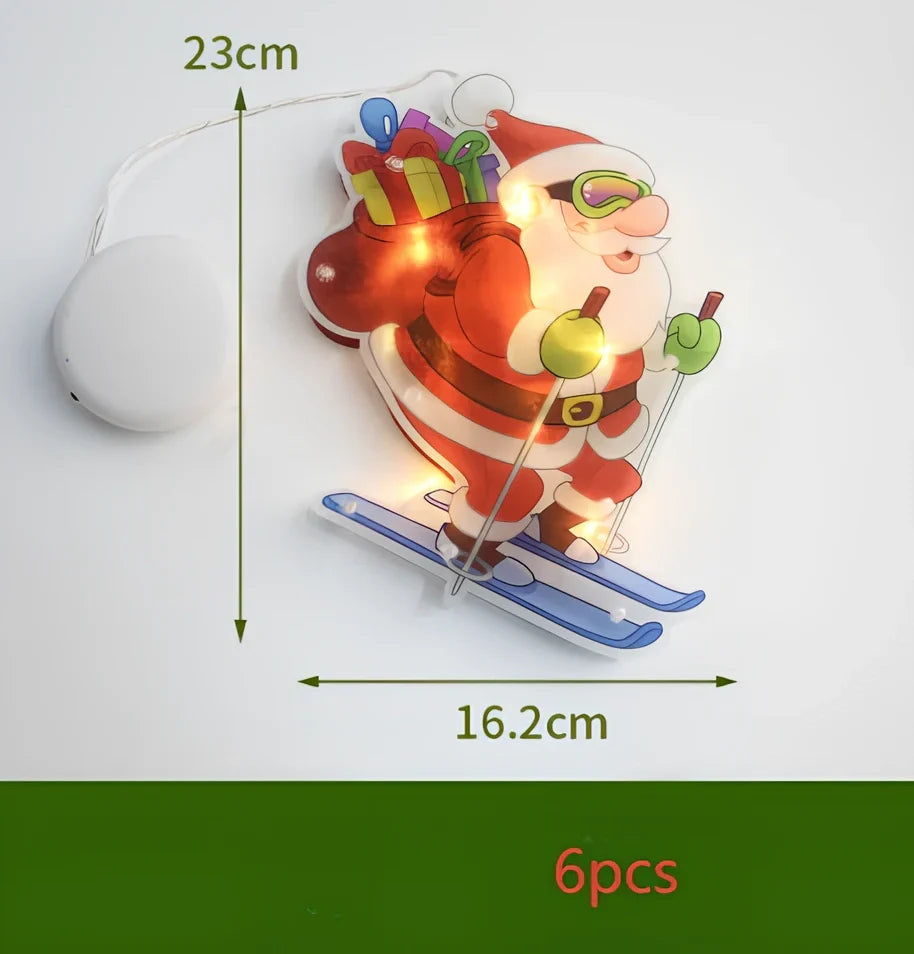 LED Christmas hanging lights with suction cups showing snowman design illuminated on window