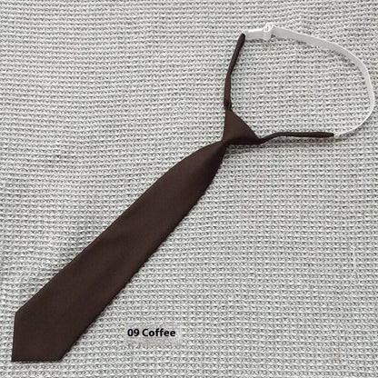Men's navy blue cotton bow tie with arrow style shape on a white background.