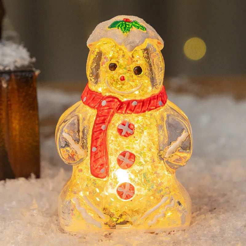Glowing gingerbread man Christmas ornament measuring 6.5cm wide with LED lights and red scarf