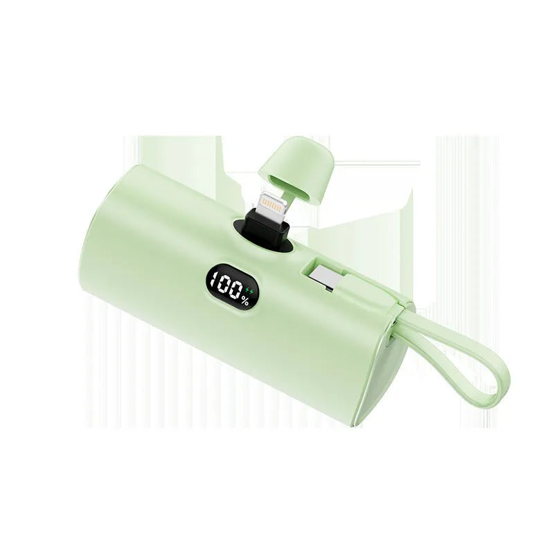 Capsule digital display wireless power bank showing battery percentage on screen, compact 79x34x26mm design with integrated plug