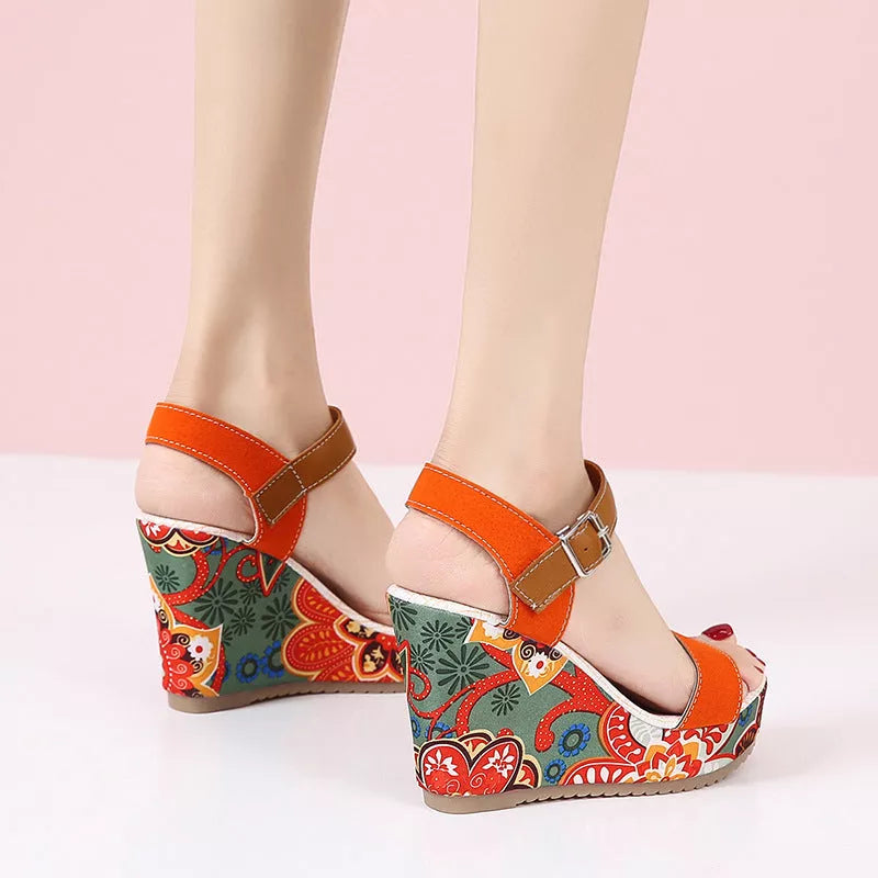 Women's floral embroidered high wedge sandals with buckle strap in black, green, and orange