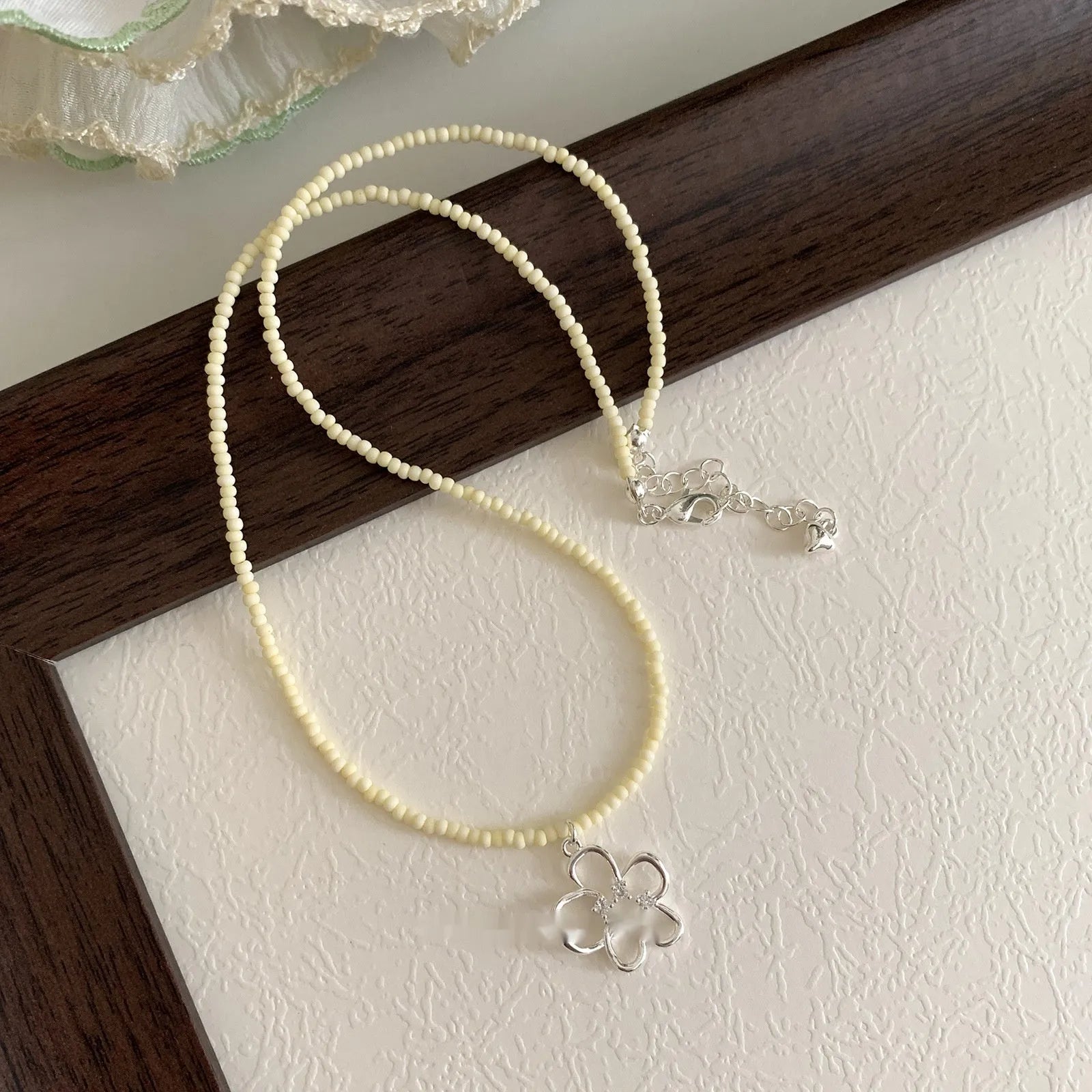 Women's colourful beaded hollow flower necklace in Korean style with copper chain.