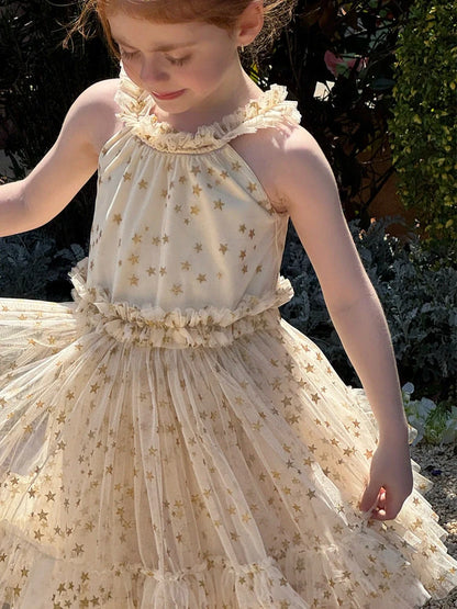 Apricot-coloured girls' halter neck tulle skirt with sleeveless design and floaty appearance