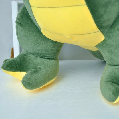 Green dinosaur plush toy with reversible sequins showing flipped design patterns