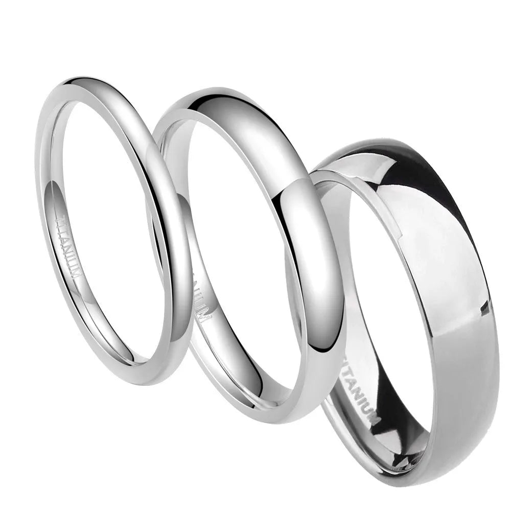 Silver titanium steel unisex ring with grinding texture on finger, showing different band width options.