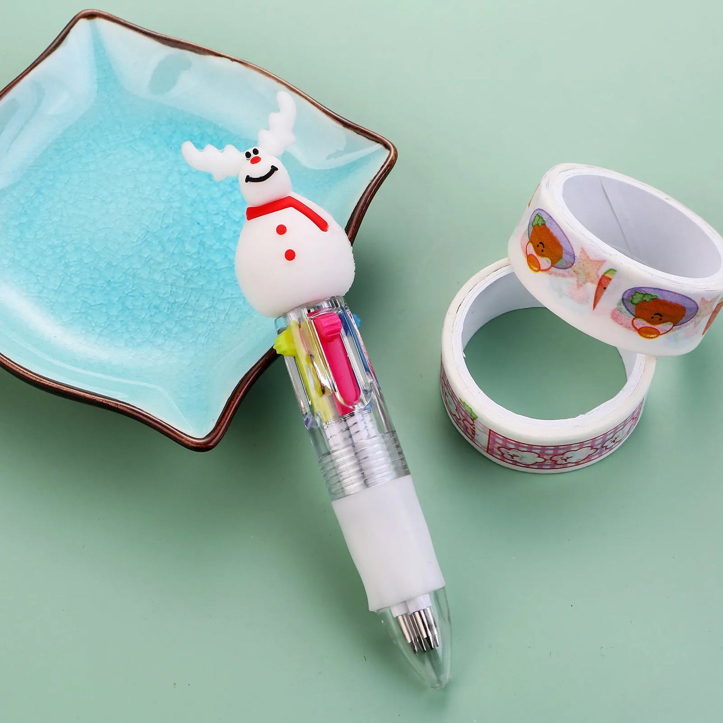 Christmas four-colour ballpoint pen with press mechanism showing festive designs