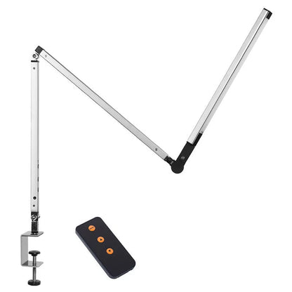 Clip-on adjustable arm LED desk lamp in black mounted on a desk edge with remote control.