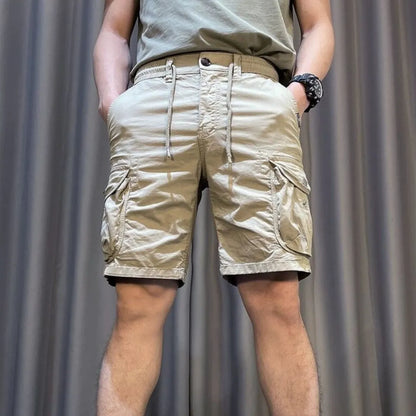 Loose straight multi-pocket casual overalls pants in black, grey, green, or khaki with a relaxed fit and five pockets.