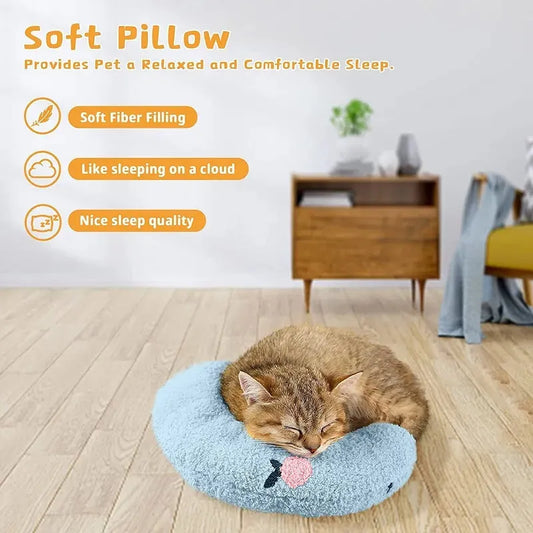 White U-shaped pet pillow measuring 27cm with raised rim supporting small cat's neck and back