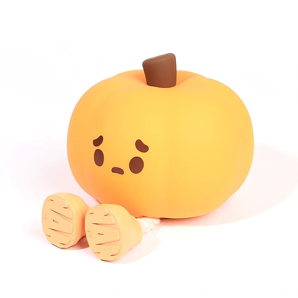 Orange silicone pumpkin night lamp measuring 98x105x83mm with built-in battery and USB charging port