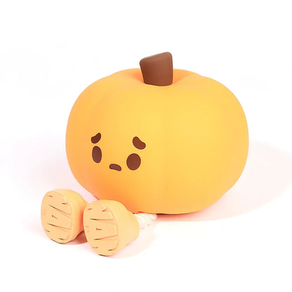 Orange silicone pumpkin night lamp measuring 98x105x83mm with built-in battery and USB charging port