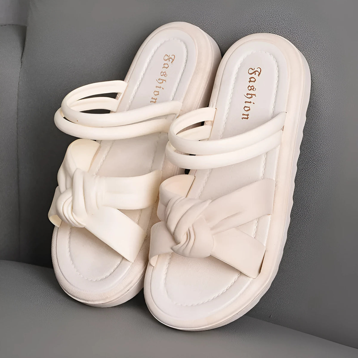 Women's black PVC sandals with thick soft back, floral detail, and injection moulded sole