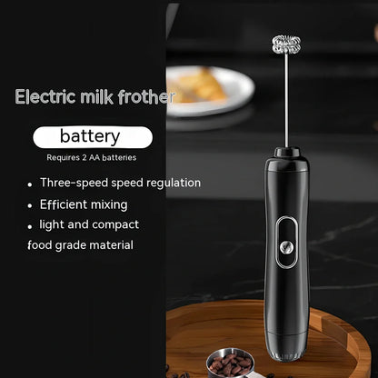 Battery-powered handheld milk frother in retro green, black, or white with stainless steel whisk