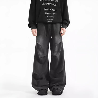 Men's cotton straight-leg sweatpants in black and gray with pleated washed finish and elastic waist