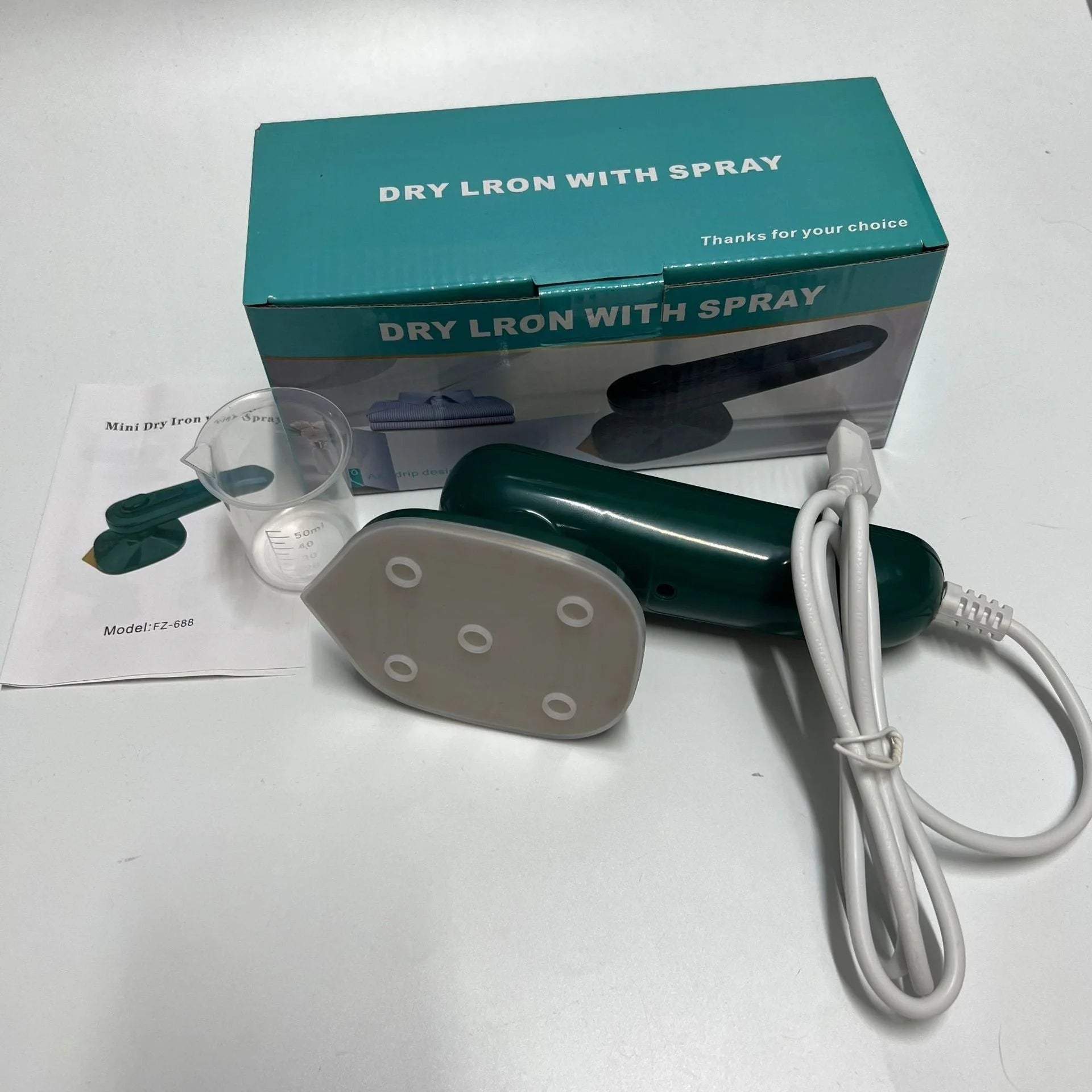 Dark green handheld portable garment ironing machine with titanium panel