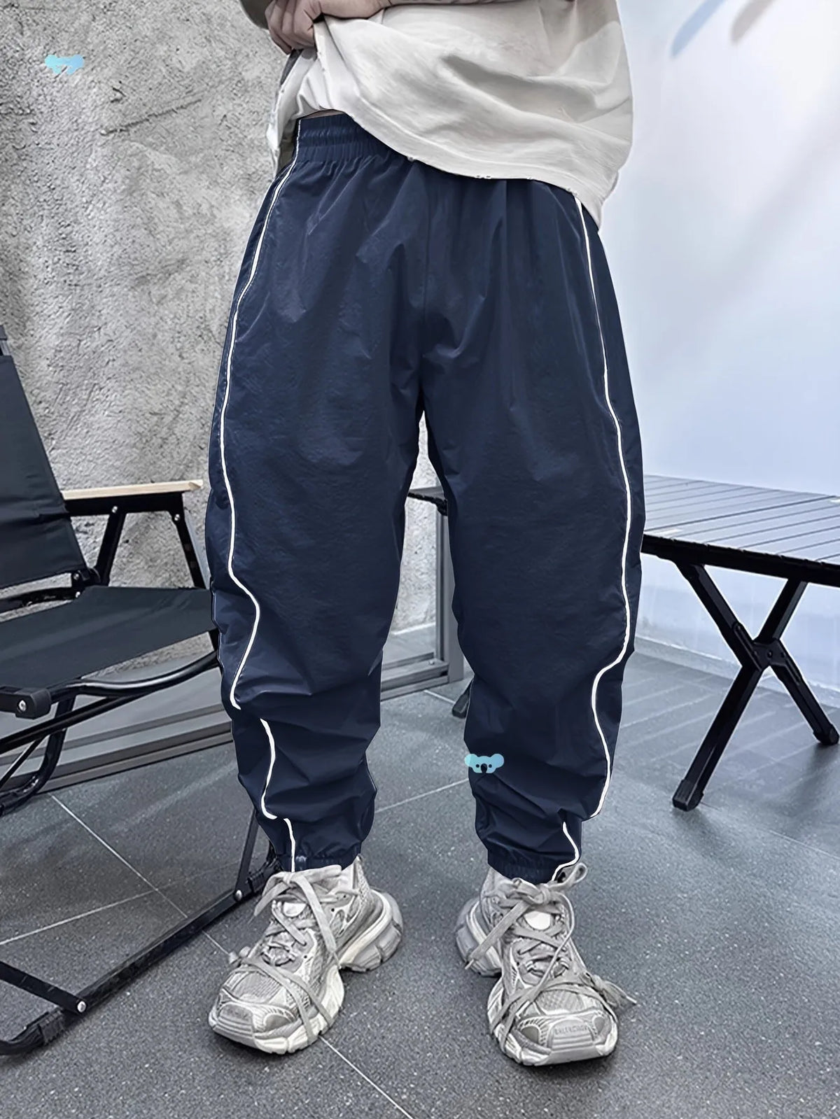 Men's bamboo fibre cropped sports trousers in army green colour showing loose fit and elastic waistband