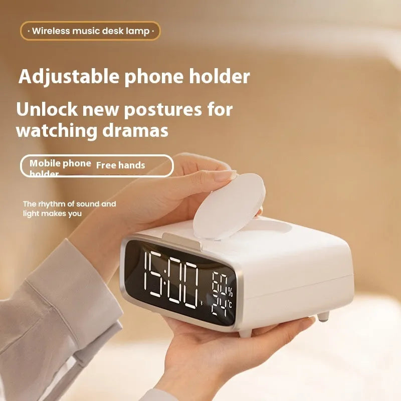 White Bluetooth speaker wireless charger with night lamp functions on wooden surface