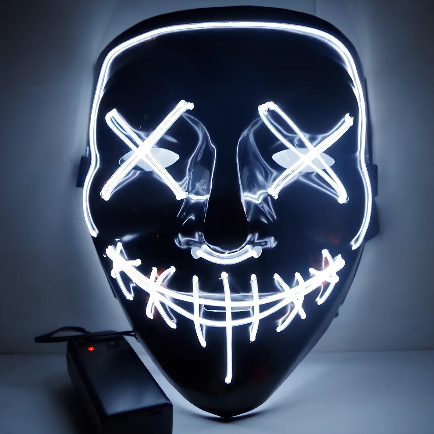 Black V-shaped electroluminescent Halloween mask glowing with uniform illumination, showing folding capability and plastic construction