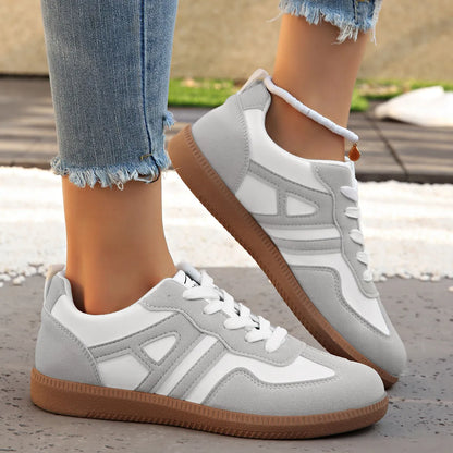 Women's retro lace-up jogging shoes in black, grey, or khaki with a platform sole.