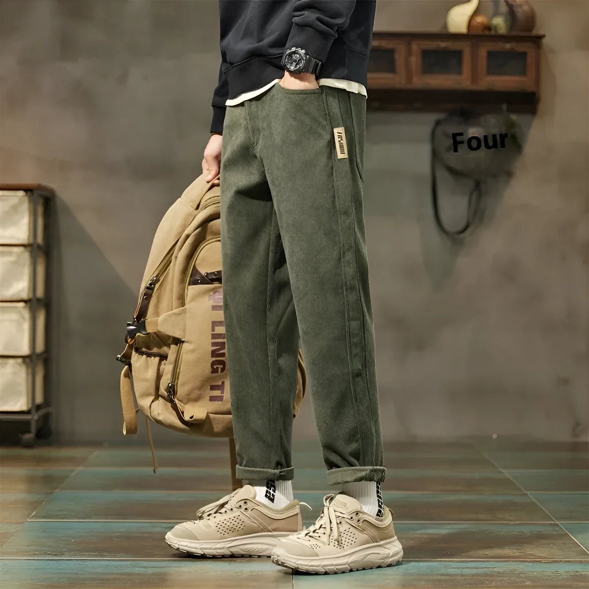 Men's straight-leg corduroy pants in army green colour with tapered fit and mid waist design