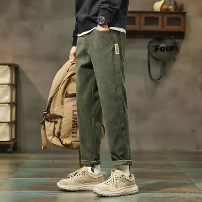 Men's straight-leg corduroy pants in army green colour with tapered fit and mid waist design