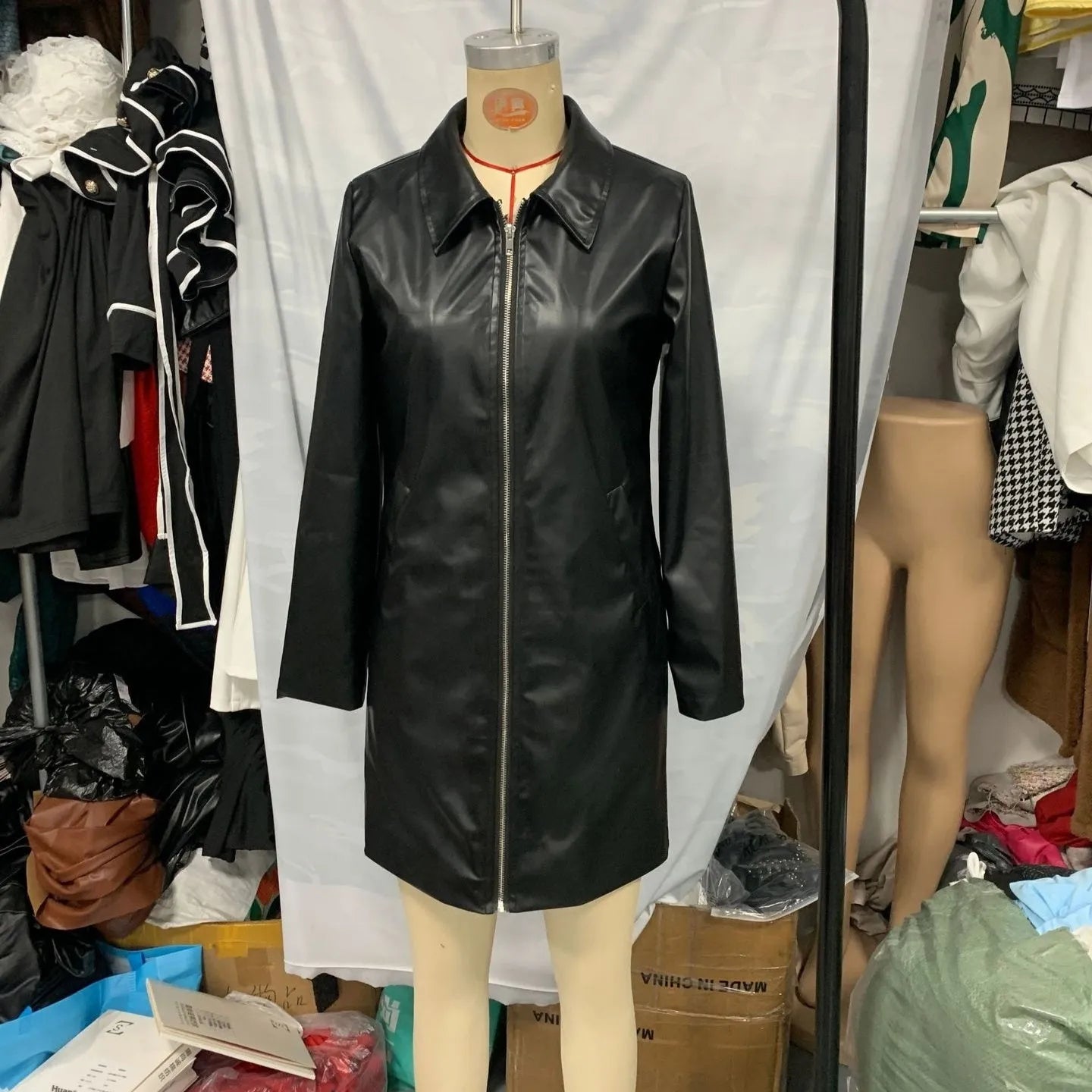Women's black leather-style jacket with medium 65cm length and long sleeves