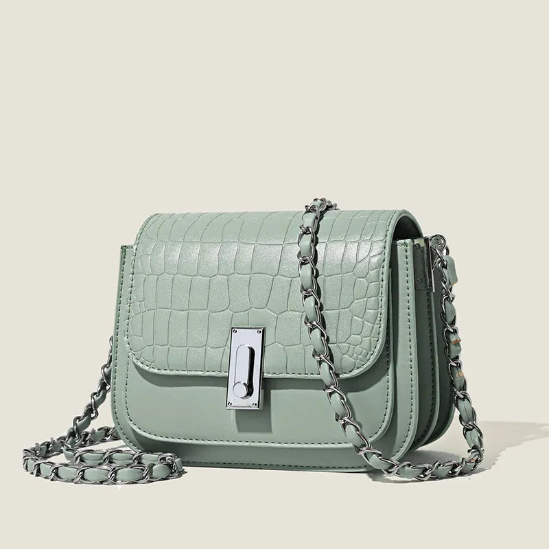 Women's soft PU shoulder bag with chain strap, horizontal square design in black colour showing sandwich pocket