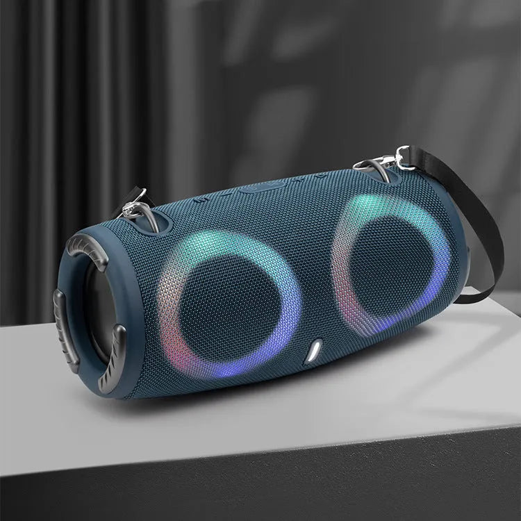 War Drum Bluetooth speaker in blue with RGB coloured lights, showing waterproof design and included strap for portable use