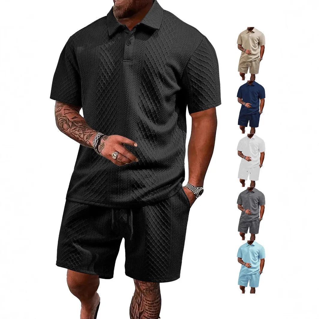 Men's patterned cloth casual suit set with short sleeve polo top and trousers on a hanger.