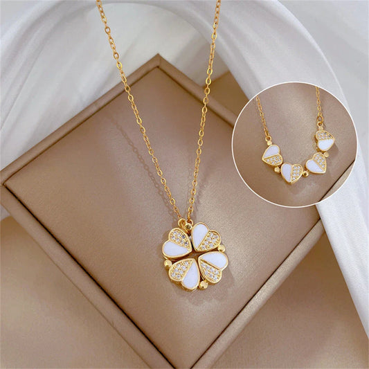 Elegant four-leaf clover pendant necklace with sparkling crystal heart detail, made of premium stainless steel for women's fashion jewelry gift