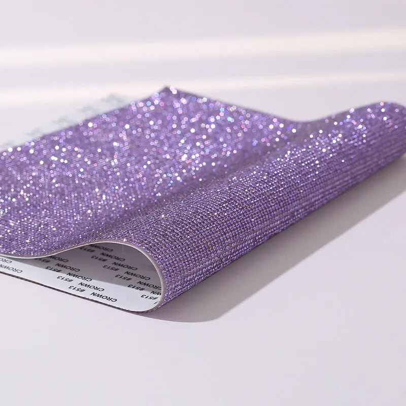 Rhinestone sticker net on backing sheet for hot drilling application to fabrics in multiple colour options
