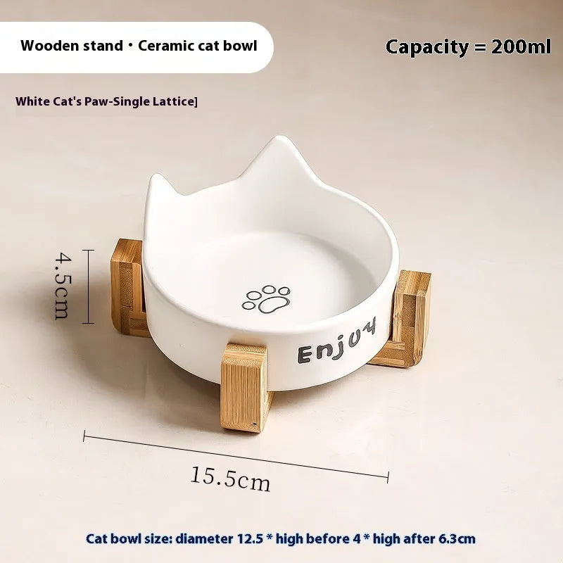 Porcelain cat bowl with anti-tumble wooden frame in pink with a cat paw design