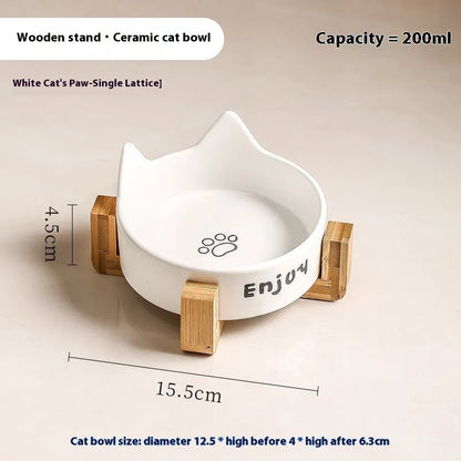 Porcelain cat bowl with anti-tumble wooden frame in pink with a cat paw design