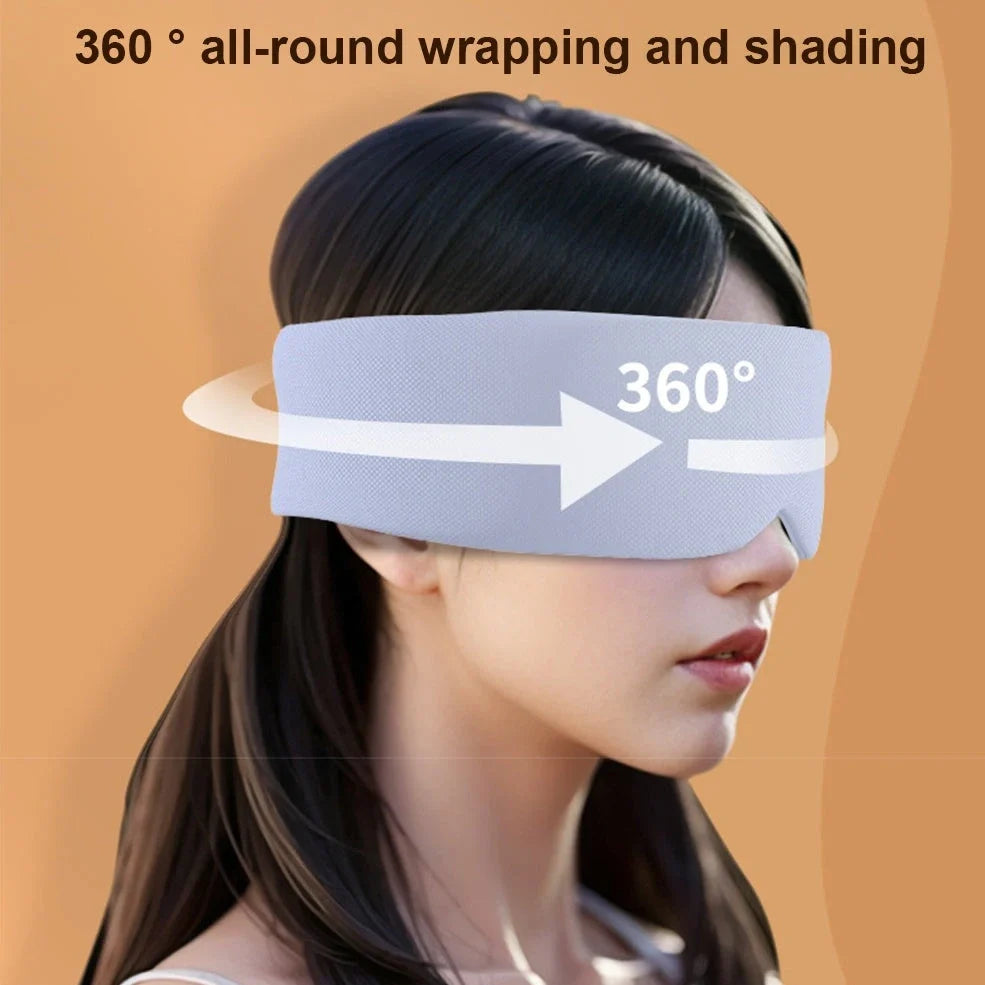 Gray double-sided sleep mask showing cool ice silk side and warm cotton side with adjustable magic tape closure