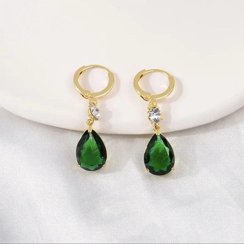 Green geometric teardrop earrings in alloy metal with a classic drop design, versatile for formal occasions or everyday wear, presenting a stylish emerald-coloured jewellery accessory for women
