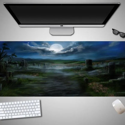 Oversized black Halloween-themed mouse pad with pumpkin design on a wooden desk, showing full 300mm width.