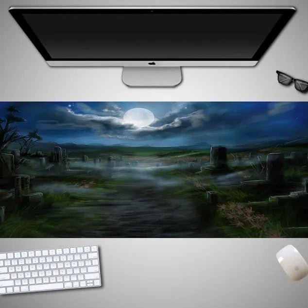 Oversized black Halloween-themed mouse pad with graphic design on a desk with keyboard and mouse