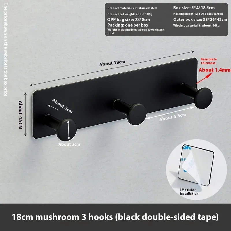 Screwless mushroom-style clothes hook with adhesive backing, shown in white on a tiled wall.