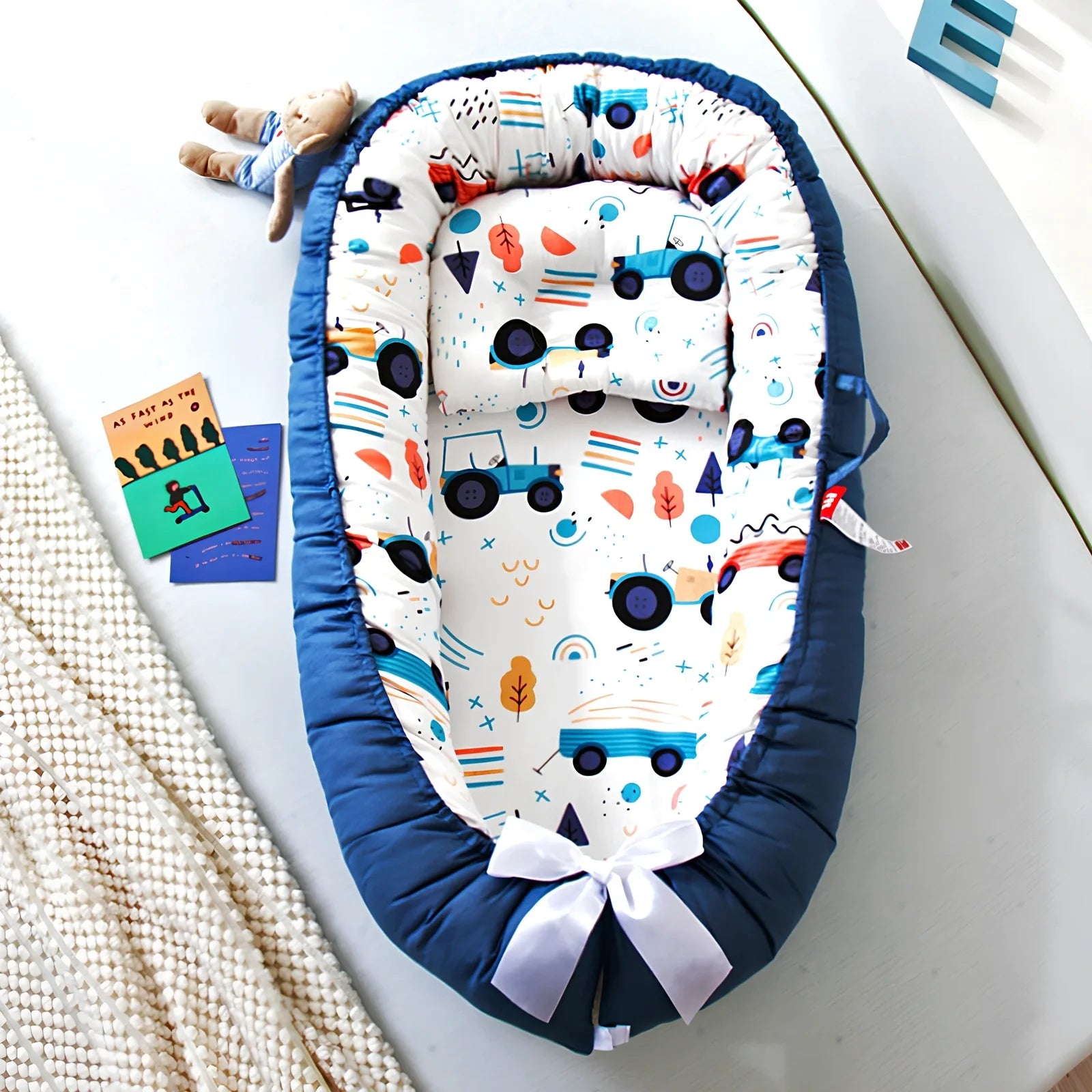 Portable foldable baby bed measuring 85x45cm with cartoon pattern, shown in green elk design