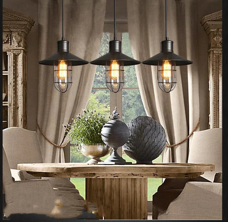 Black iron pendant lamp with cage-style explosion-proof glass shade and adjustable hanging chain